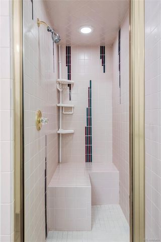 a bathroom with a shower and a tub