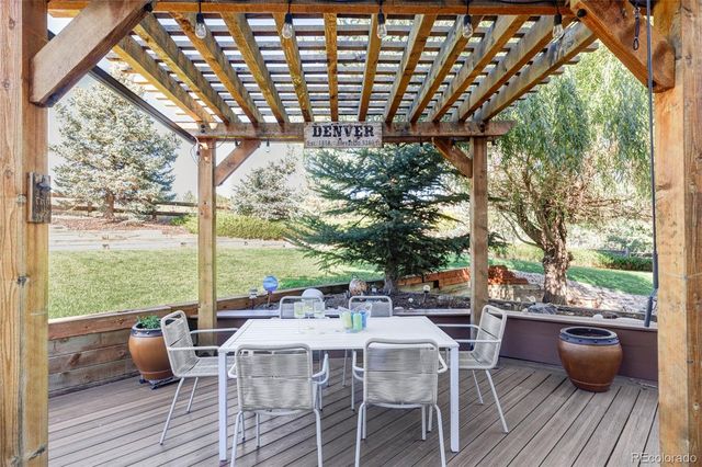 a view of a park with bench and trees