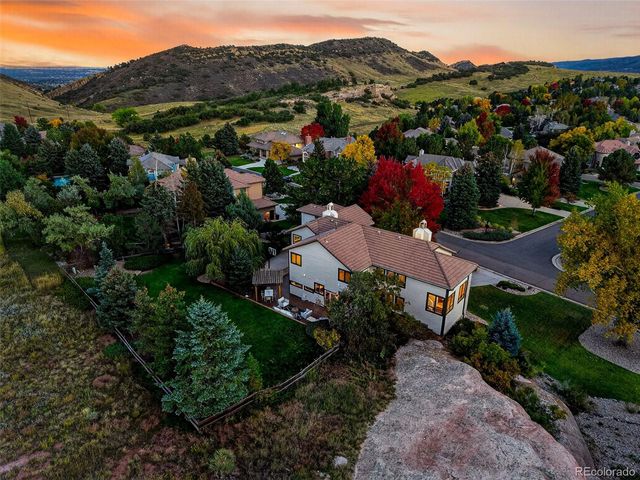 a view of houses with outdoor space and city view