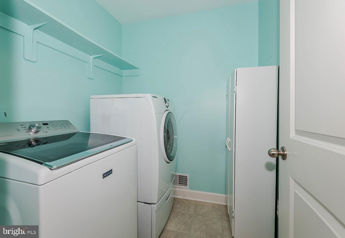 647 210th Street Pasadena, MD 21122 - Photo 14 of 44 a utility room with dryer and washer