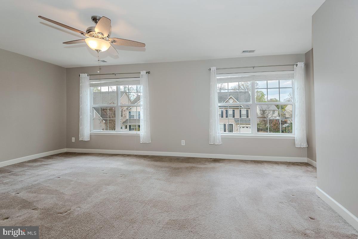 647 210th Street Pasadena, MD 21122 - Photo 16 of 44 a view of an empty room with a window