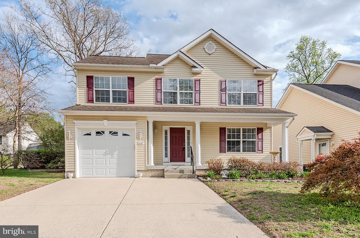 647 210th Street Pasadena, MD 21122 - Photo 2 of 44 front view of a house with a yard