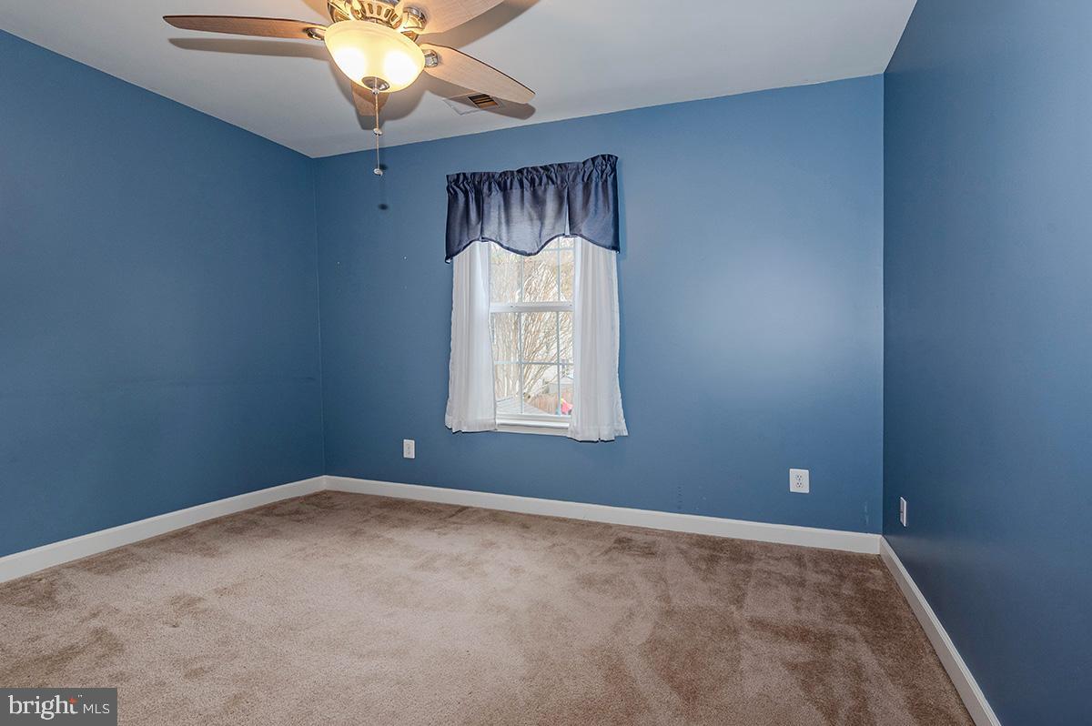 647 210th Street Pasadena, MD 21122 - Photo 21 of 44 a view of an empty room with a window
