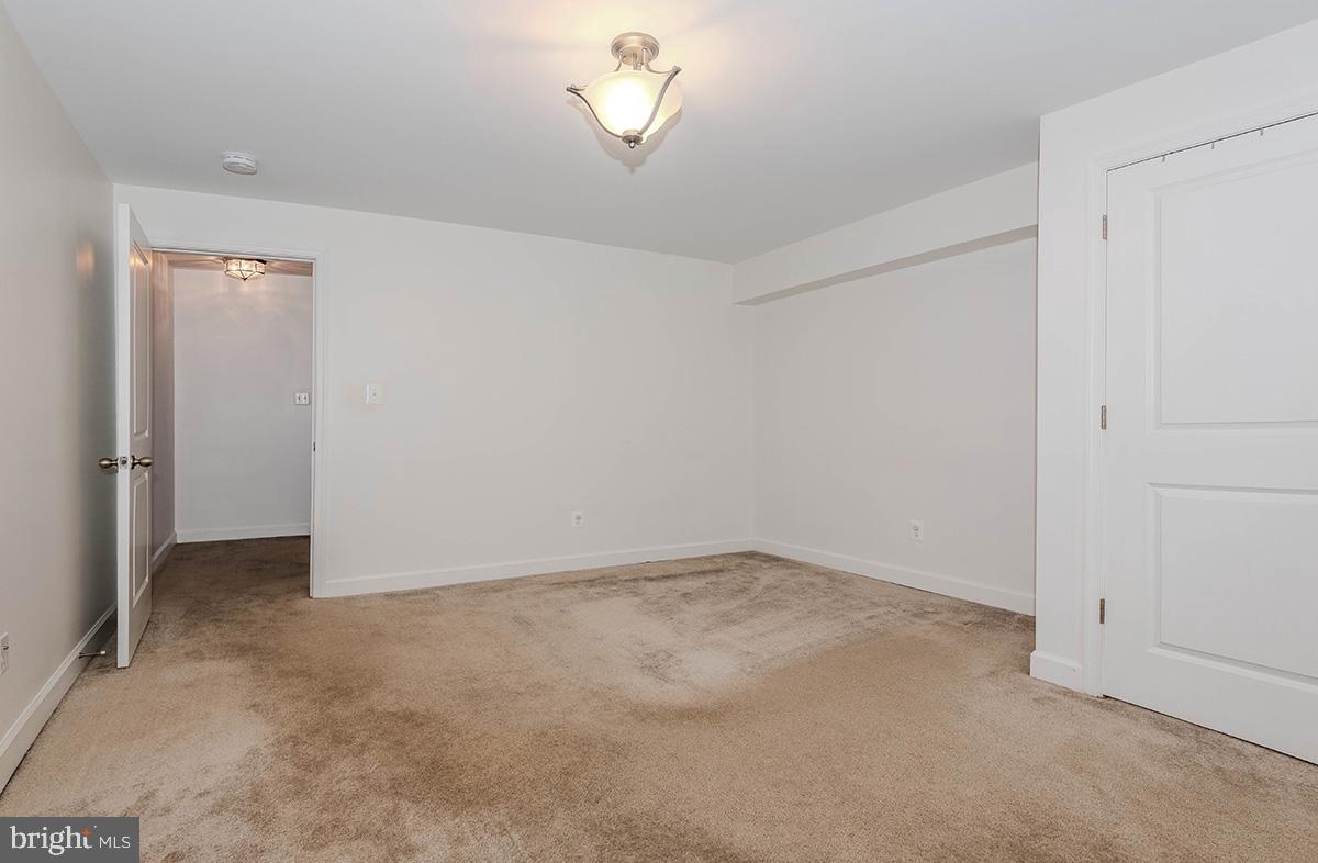 647 210th Street Pasadena, MD 21122 - Photo 33 of 44 a view of an empty room with a window