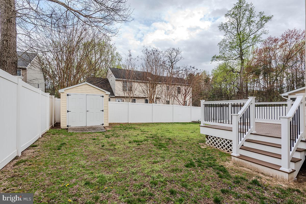 647 210th Street Pasadena, MD 21122 - Photo 35 of 44 a house with white fence