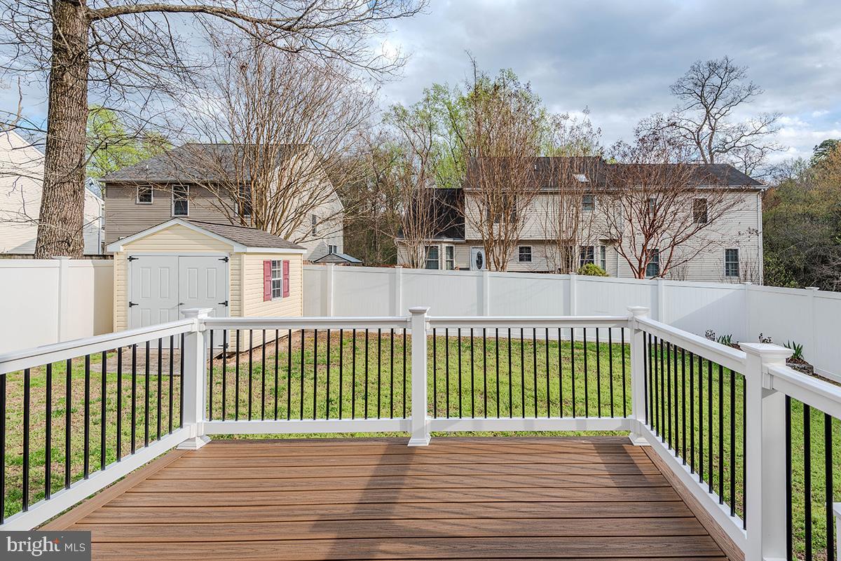 647 210th Street Pasadena, MD 21122 - Photo 36 of 44 a view of a wooden roof deck