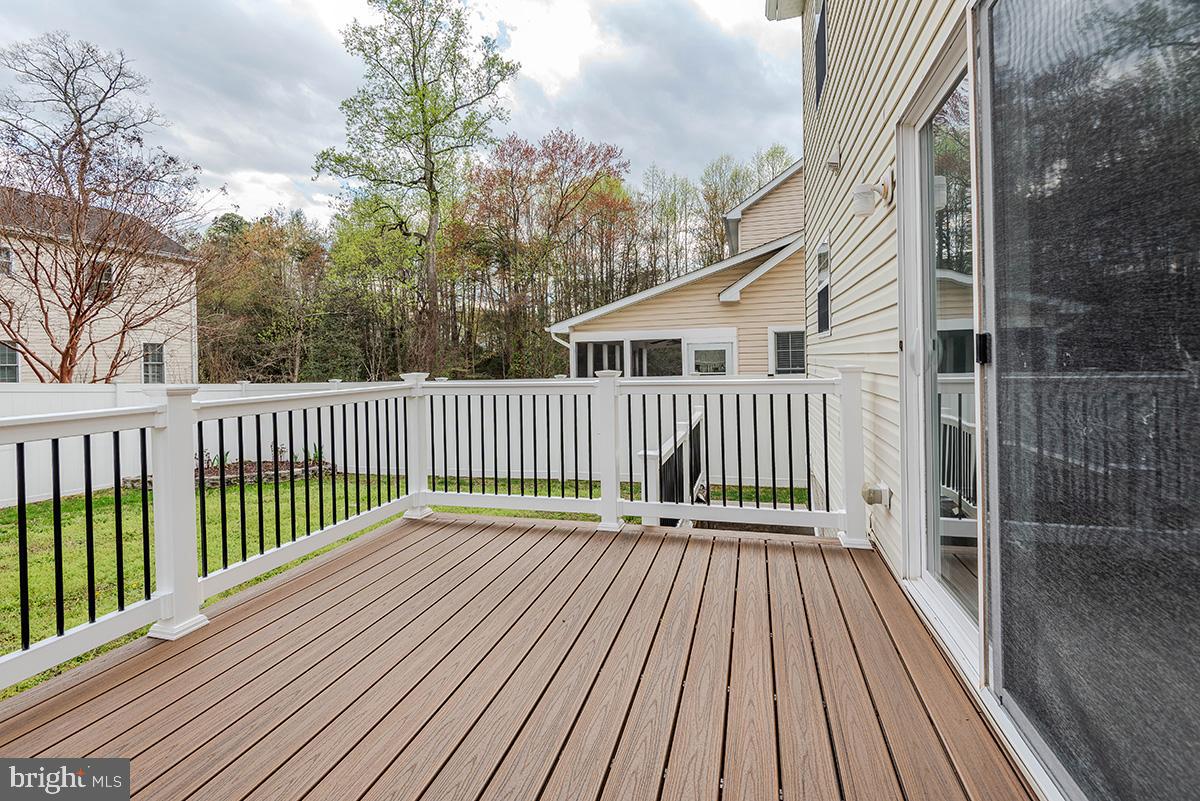 647 210th Street Pasadena, MD 21122 - Photo 37 of 44 a view of a wooden deck