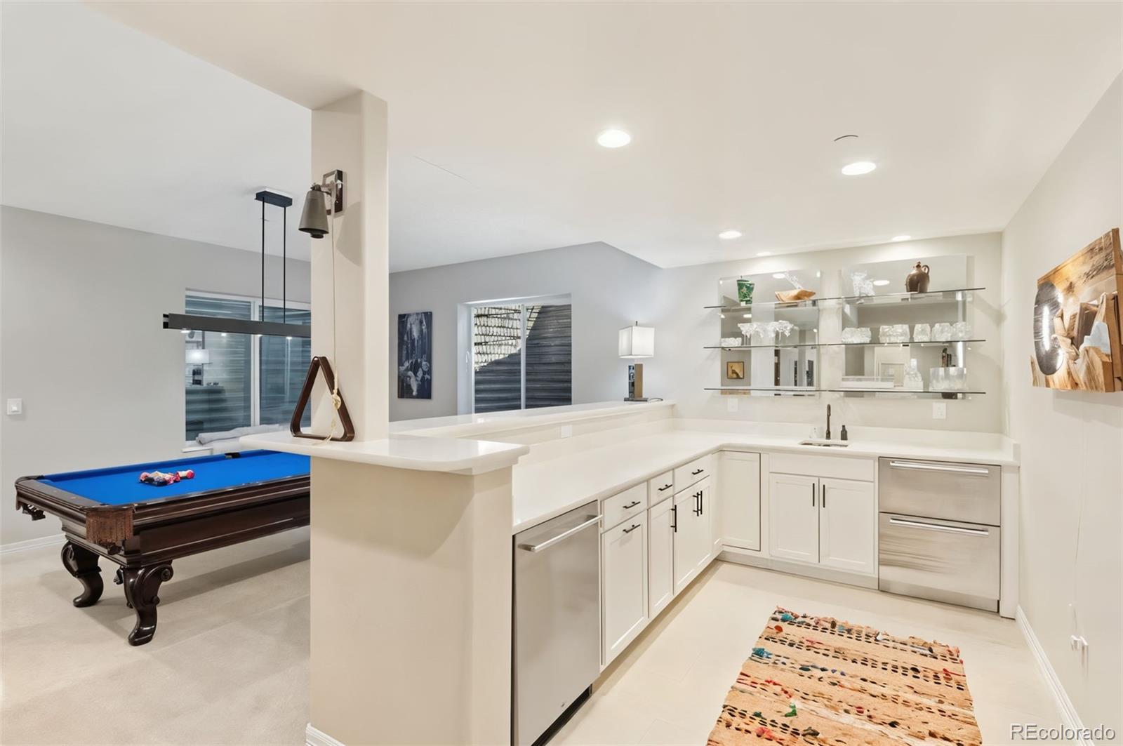 5318 Rocking Tree Grove Colorado Springs, CO 80906 - Photo 28 of 50 a kitchen with sink cabinets and window