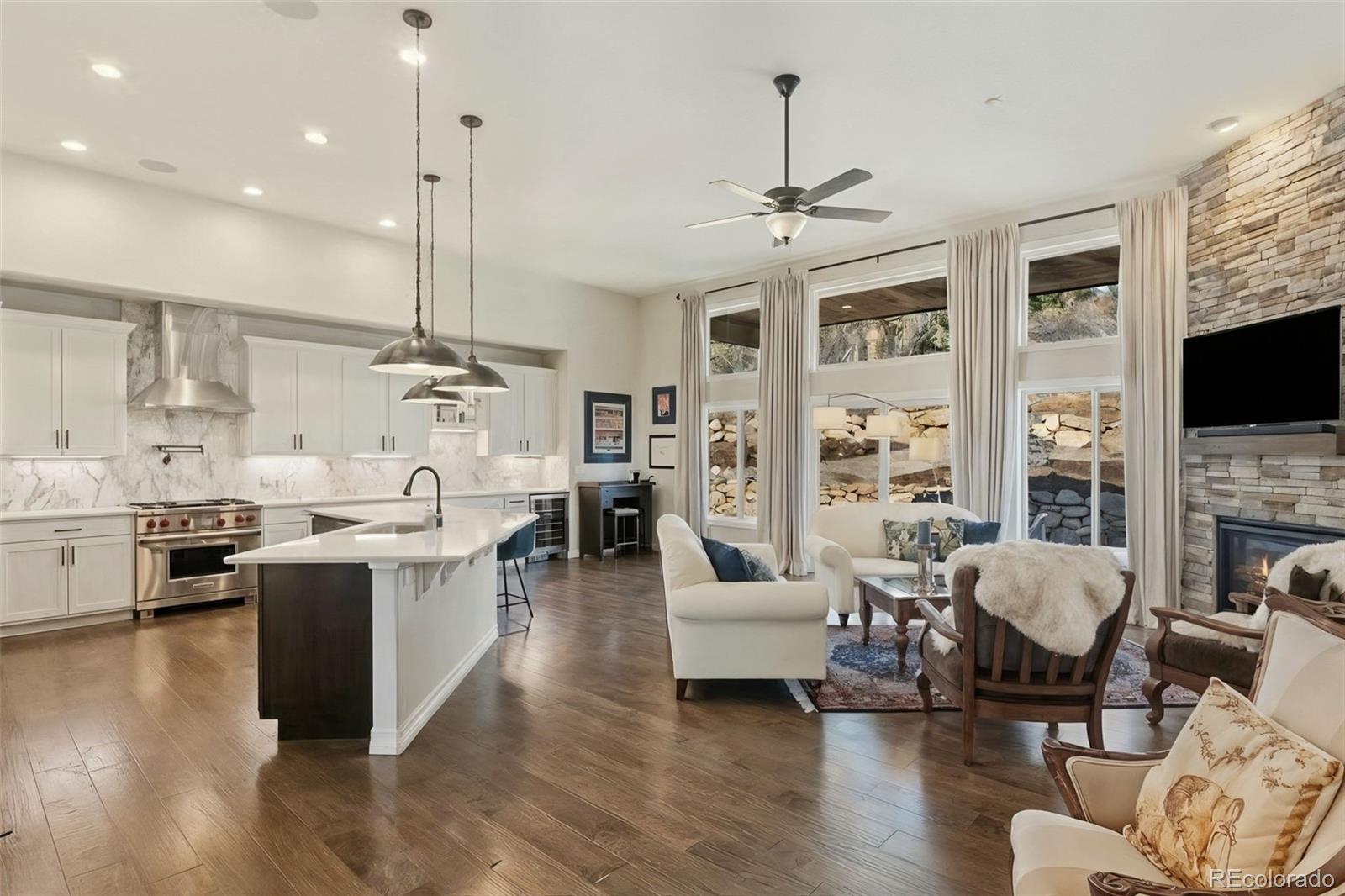 5318 Rocking Tree Grove Colorado Springs, CO 80906 - Photo 3 of 50 a living room with fireplace furniture and a flat screen tv