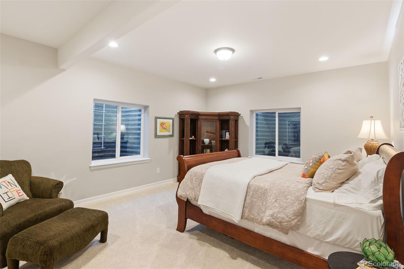 5318 Rocking Tree Grove Colorado Springs, CO 80906 - Photo 31 of 50 a bedroom with a large bed and a window