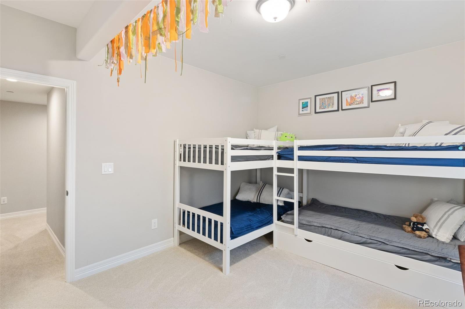 5318 Rocking Tree Grove Colorado Springs, CO 80906 - Photo 36 of 50 a bedroom with furniture and a window
