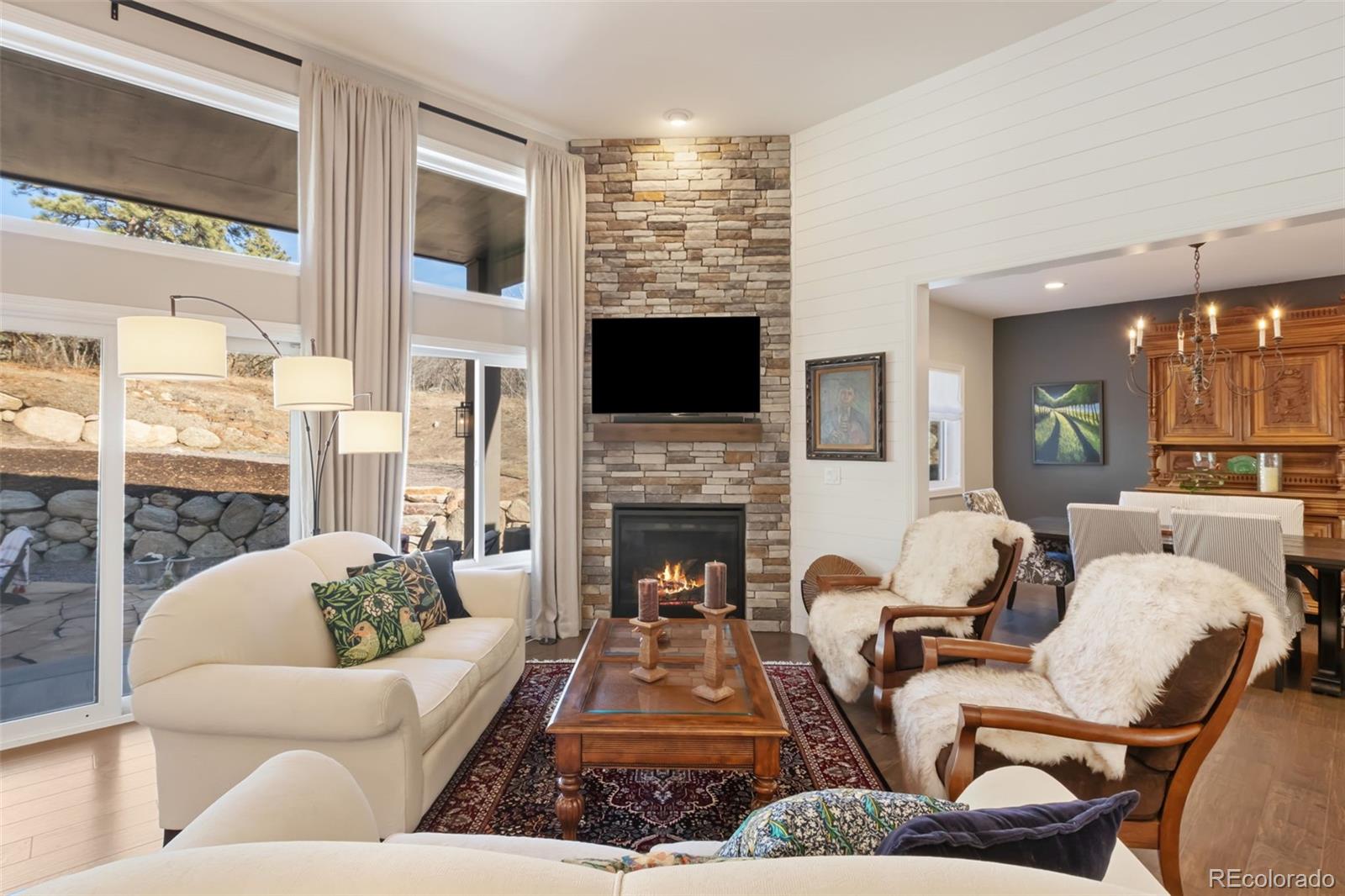 5318 Rocking Tree Grove Colorado Springs, CO 80906 - Photo 4 of 50 a living room with furniture fireplace and flat screen tv