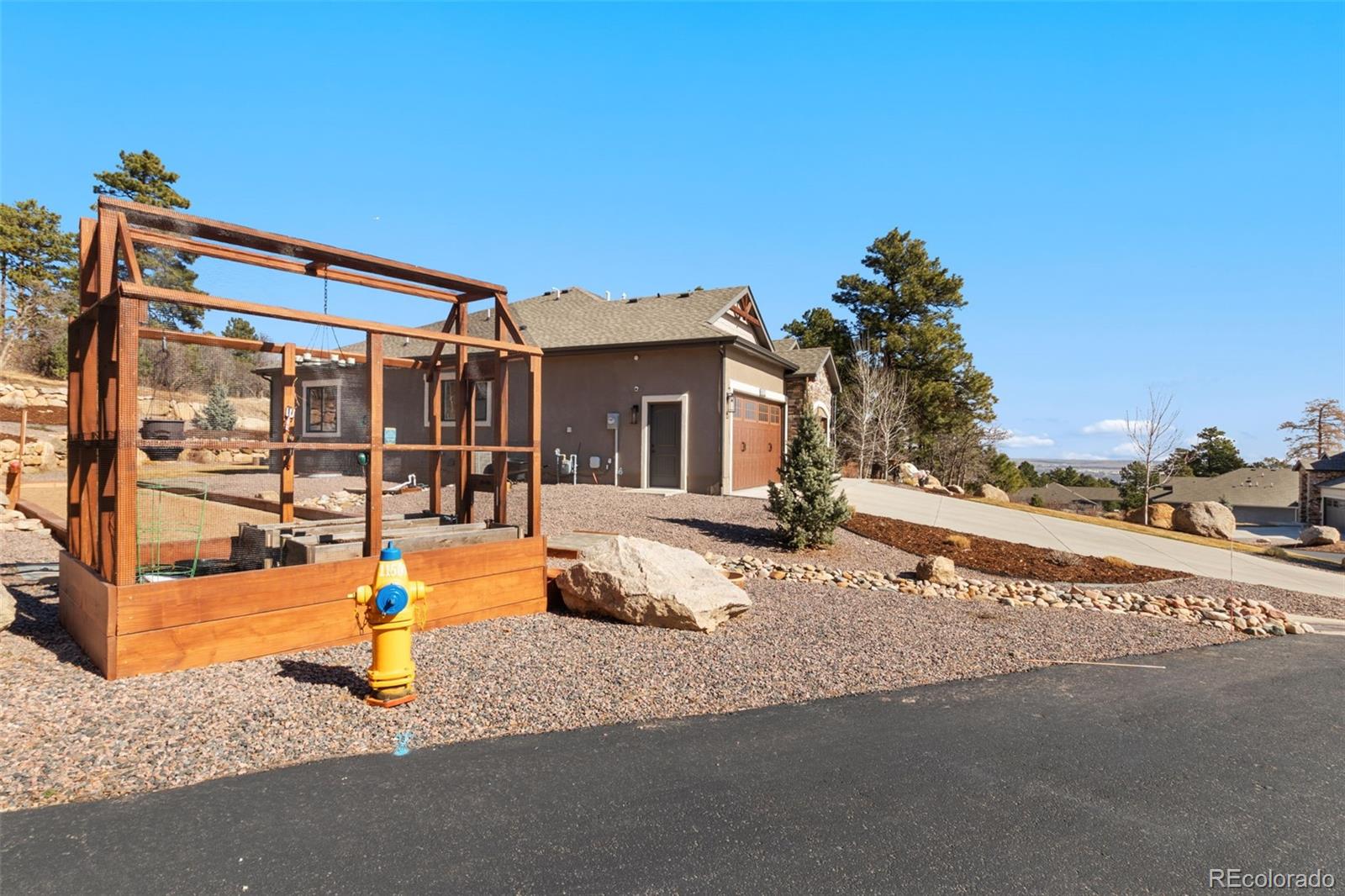 5318 Rocking Tree Grove Colorado Springs, CO 80906 - Photo 42 of 50 a front view of a house with a patio