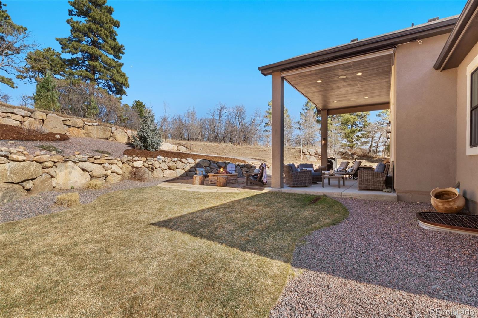 5318 Rocking Tree Grove Colorado Springs, CO 80906 - Photo 43 of 50 a view of a backyard of the house