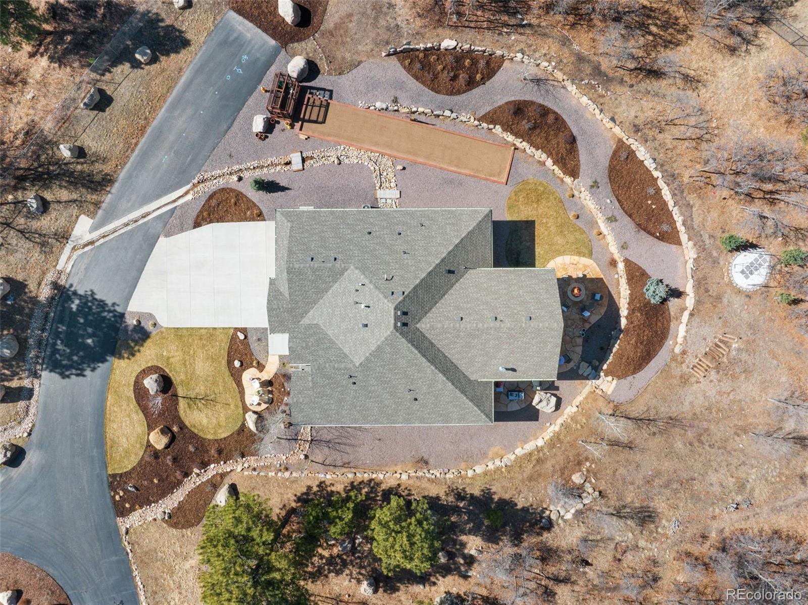 5318 Rocking Tree Grove Colorado Springs, CO 80906 - Photo 46 of 50 an aerial view of a house with a yard