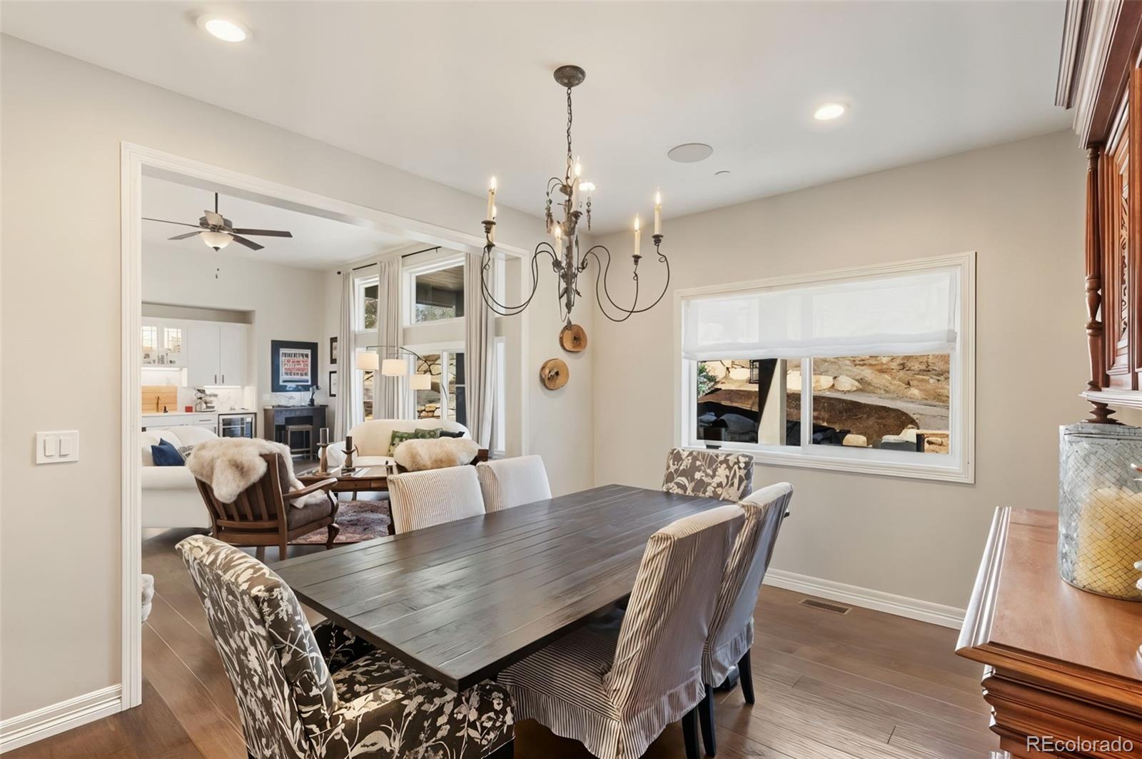 5318 Rocking Tree Grove Colorado Springs, CO 80906 - Photo 10 of 50 a view of a dining room with furniture wooden floor and chandelier