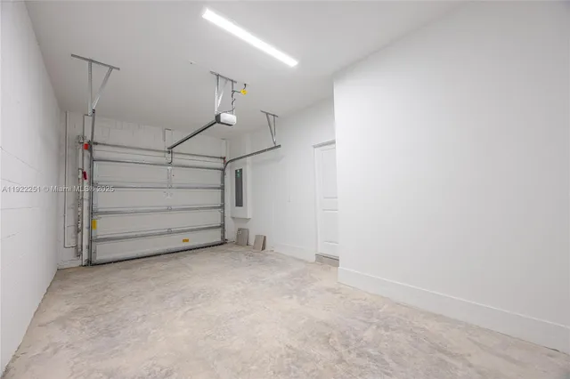 a view of room that has a white walls