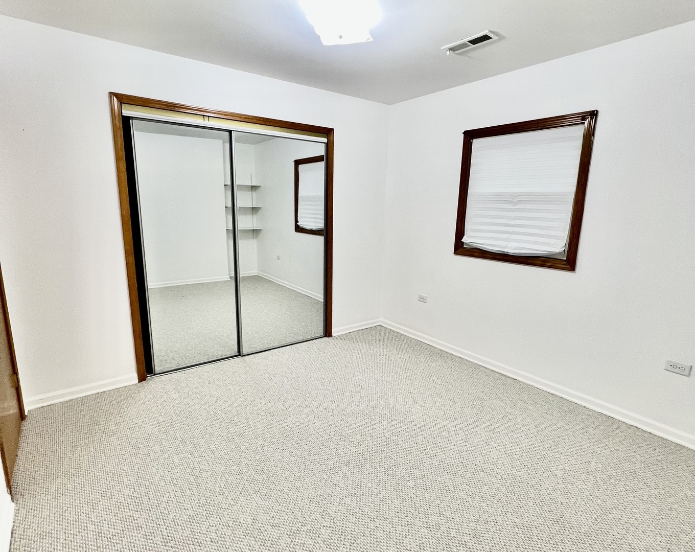 137 North 12th Avenue, Unit 2 Melrose Park, IL 60160 - Photo 5 of 8 an empty room with windows