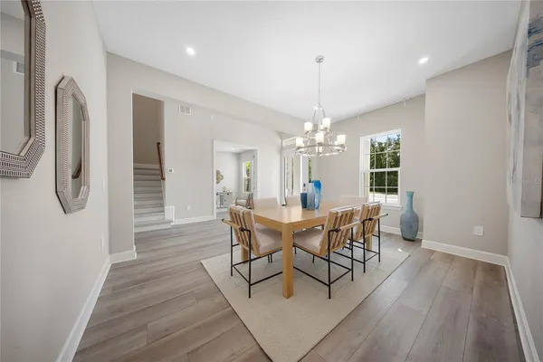 a living room with furniture flowerpot and a table
