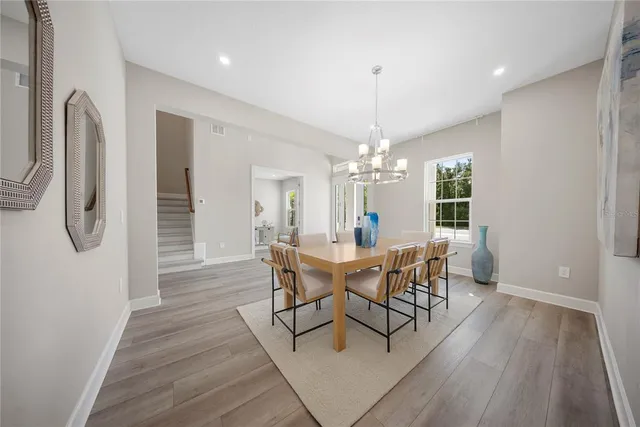 a living room with furniture flowerpot and a table