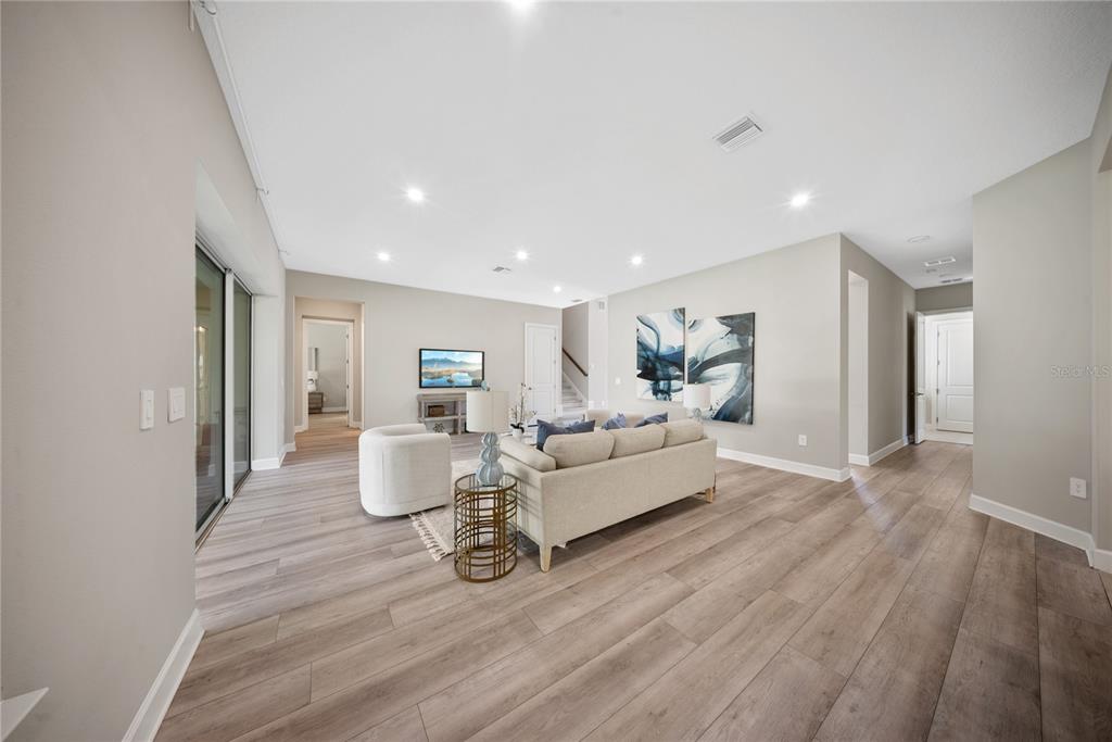 10199 Brocksport Circle Gotha, FL 34734 - Photo 19 of 82 a living room with furniture and wooden floor