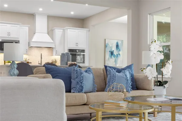 a view of a dining room with furniture and chandelier