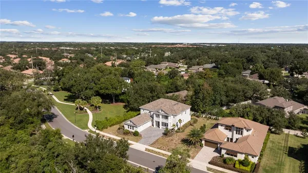 an aerial view of a house with a garden