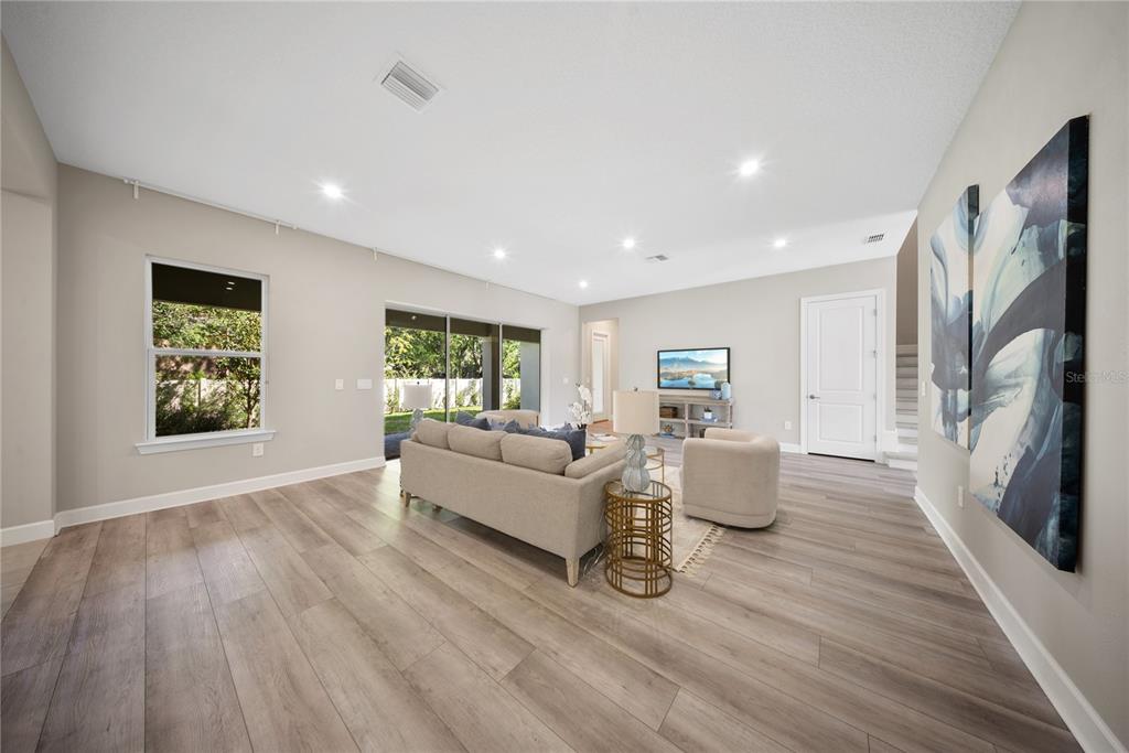 10199 Brocksport Circle Gotha, FL 34734 - Photo 21 of 82 a living room with furniture and a flat screen tv
