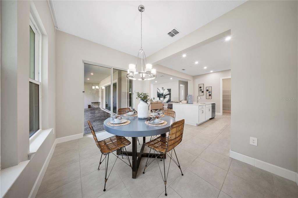 10199 Brocksport Circle Gotha, FL 34734 - Photo 27 of 82 a view of a dining room with furniture and chandelier