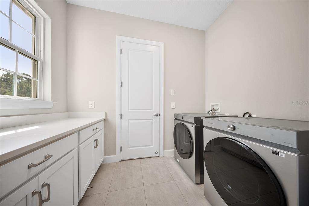 10199 Brocksport Circle Gotha, FL 34734 - Photo 32 of 82 a utility room with dryer and washer