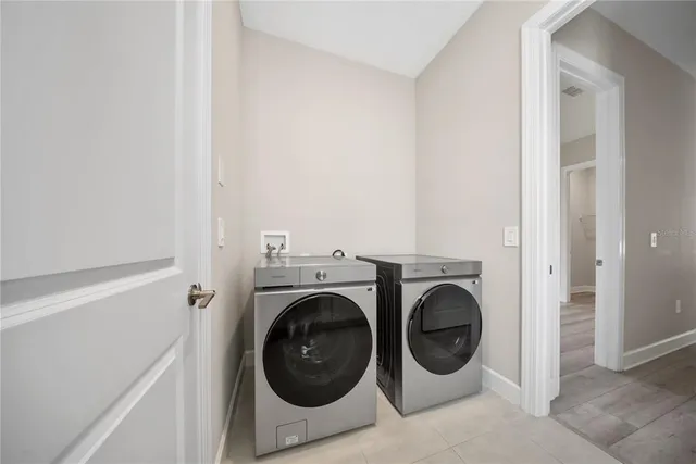 a view of storage and utility room with wooden floor