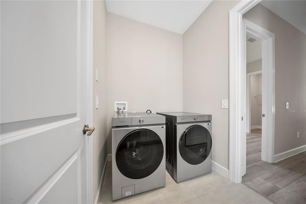 10199 Brocksport Circle Gotha, FL 34734 - Photo 33 of 82 a utility room with dryer and washer