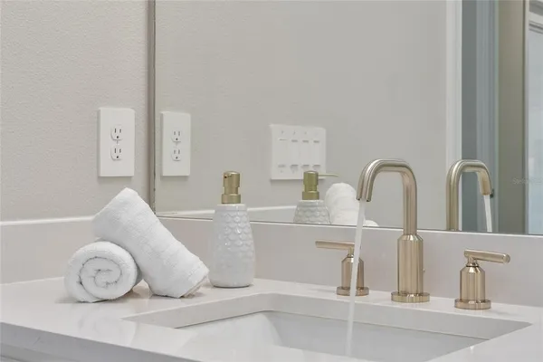 a spacious bathroom with a double vanity sink mirror double and shower