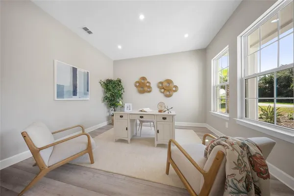 a living room with furniture and windows