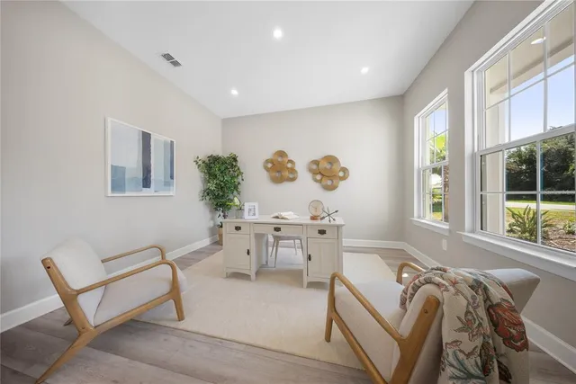 a living room with furniture and windows