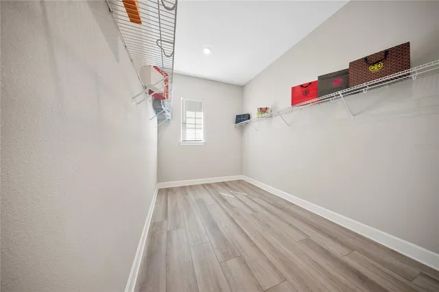 a view of an empty room with a window