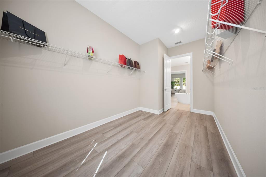 10199 Brocksport Circle Gotha, FL 34734 - Photo 44 of 82 a view of storage and utility room with wooden floor