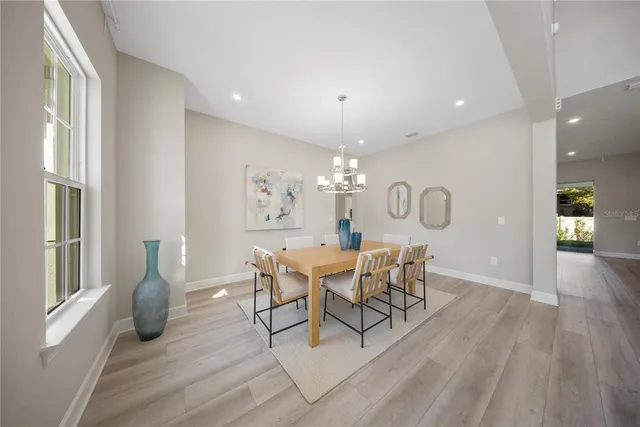 a large bathroom with a large tub sink vanity and dryer