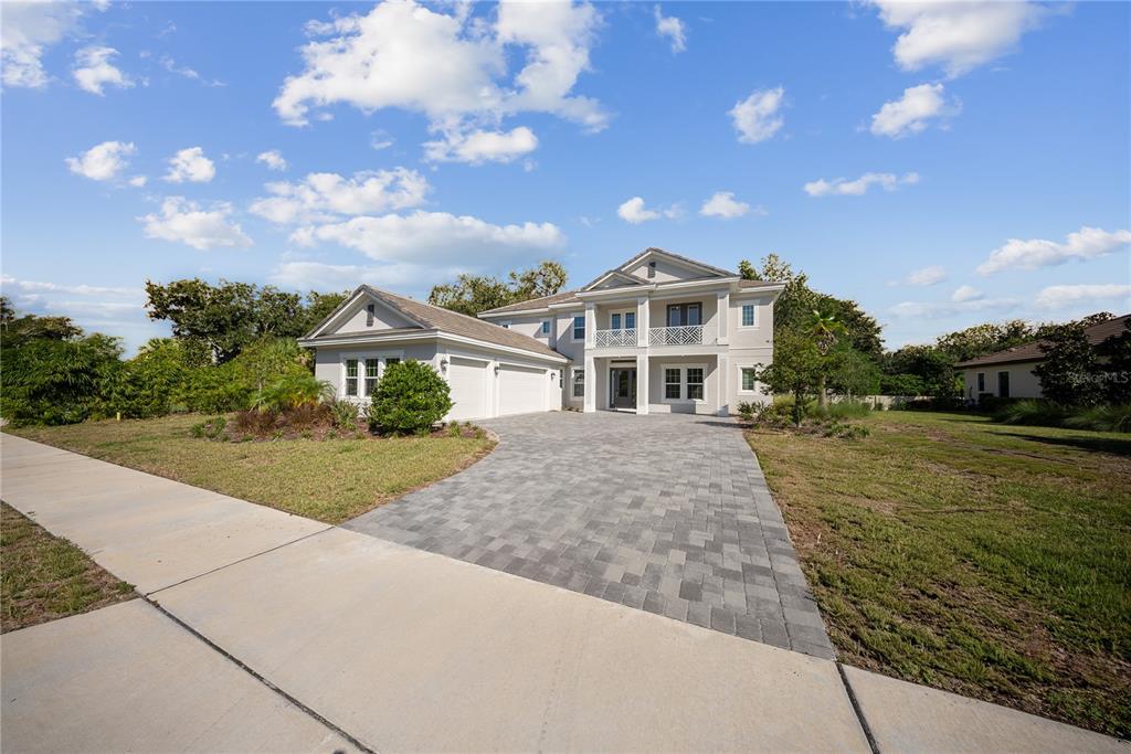 10199 Brocksport Circle Gotha, FL 34734 - Photo 74 of 82 a front view of a house with a yard and garage