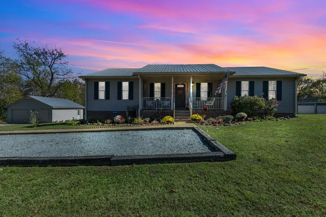 front view of a house with a yard