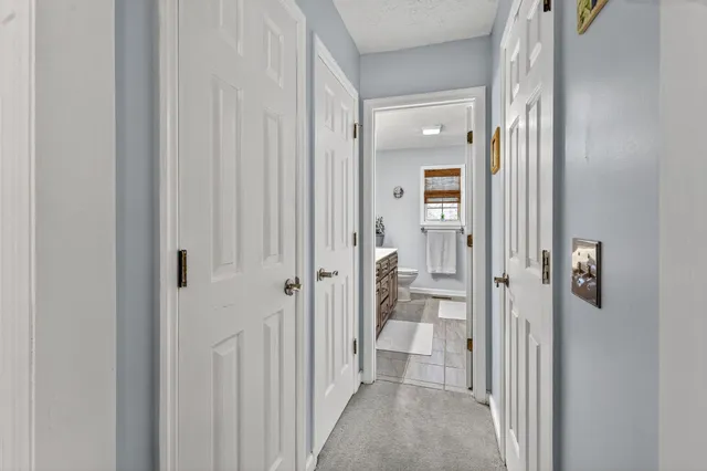 a view of a bathroom from a hallway