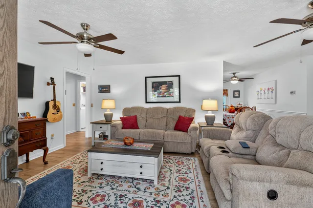 a living room with furniture and a window