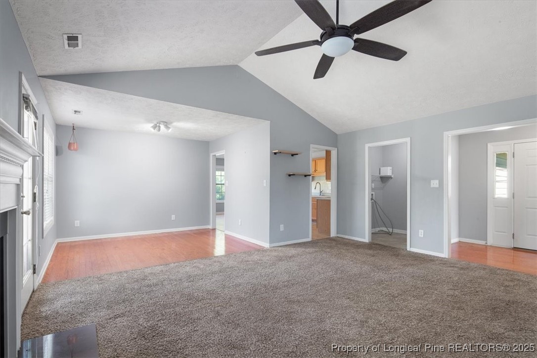 103 Beaumont Court Raeford, NC 28376 - Photo 15 of 50 a view of a big room with a ceiling fan and entryway