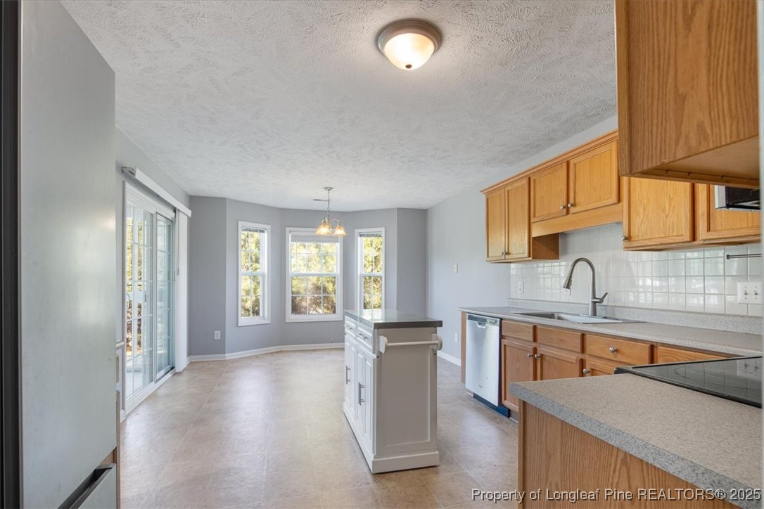 103 Beaumont Court Raeford, NC 28376 - Photo 20 of 50 a kitchen with a sink stove and cabinets