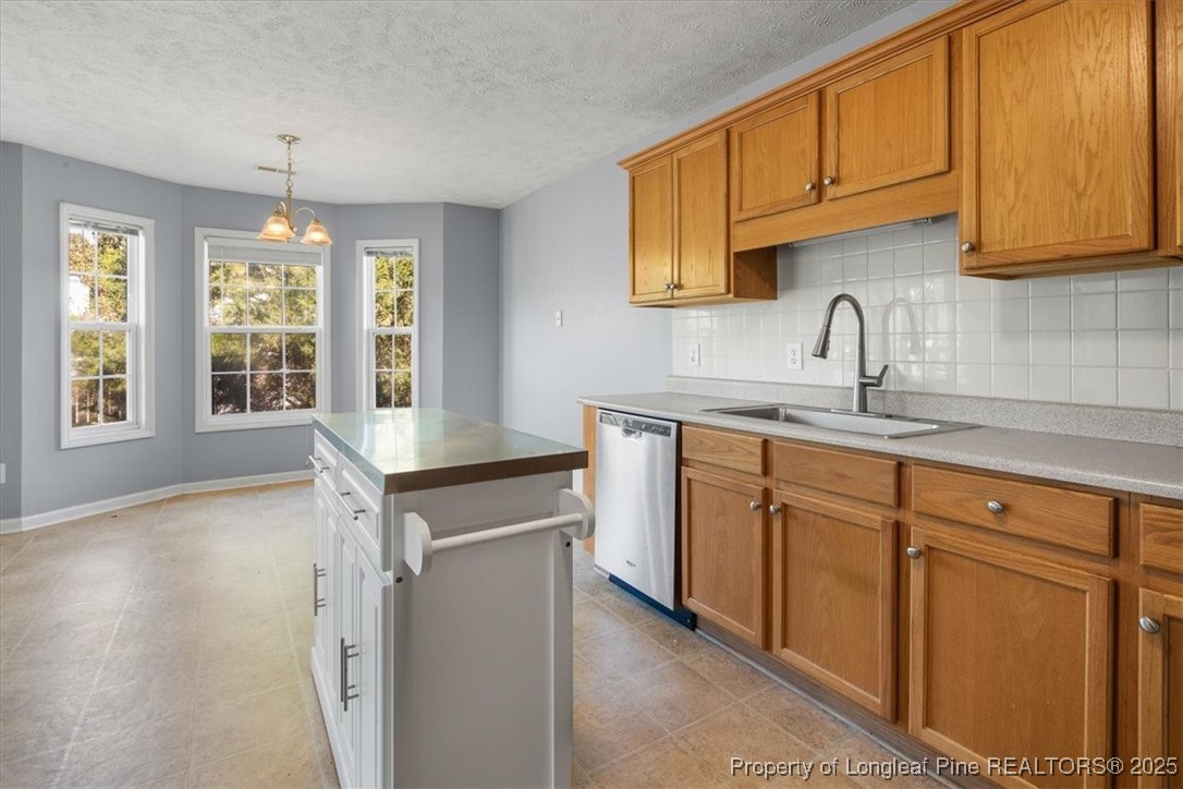 103 Beaumont Court Raeford, NC 28376 - Photo 21 of 50 a kitchen with sink cabinets and window