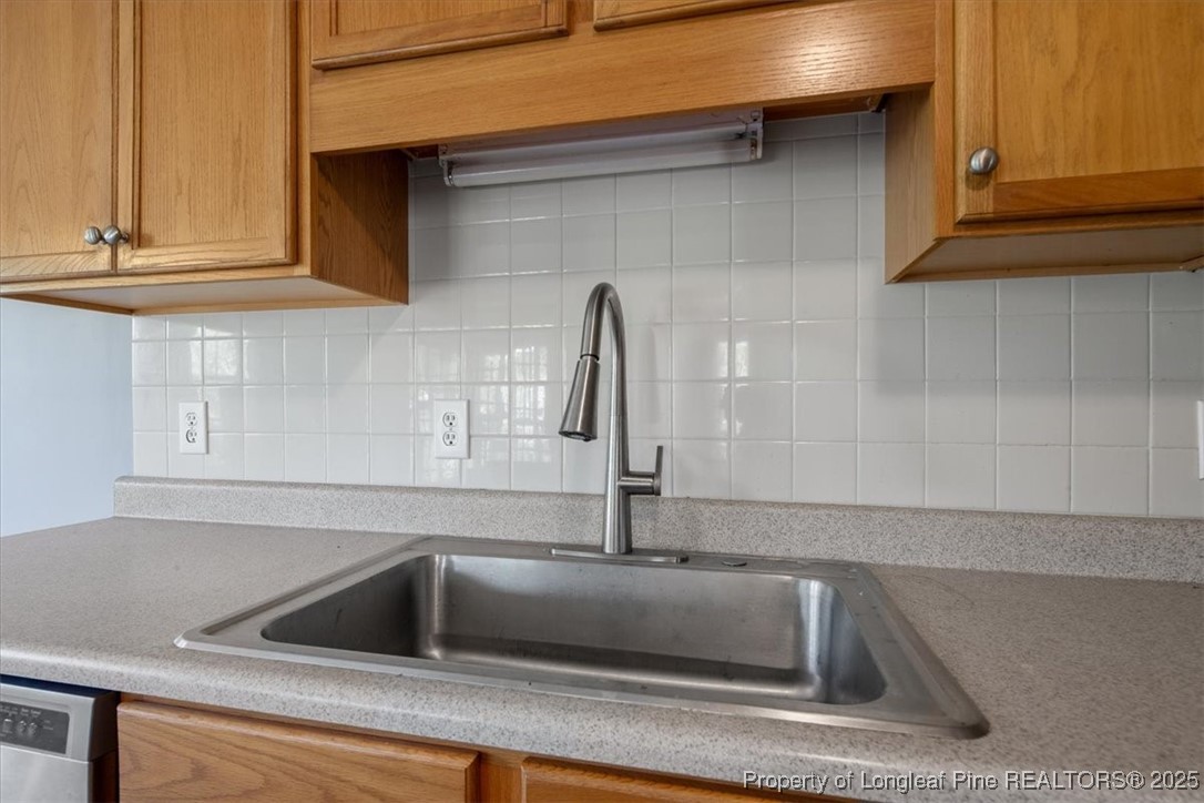 103 Beaumont Court Raeford, NC 28376 - Photo 22 of 50 a kitchen with a sink and cabinets