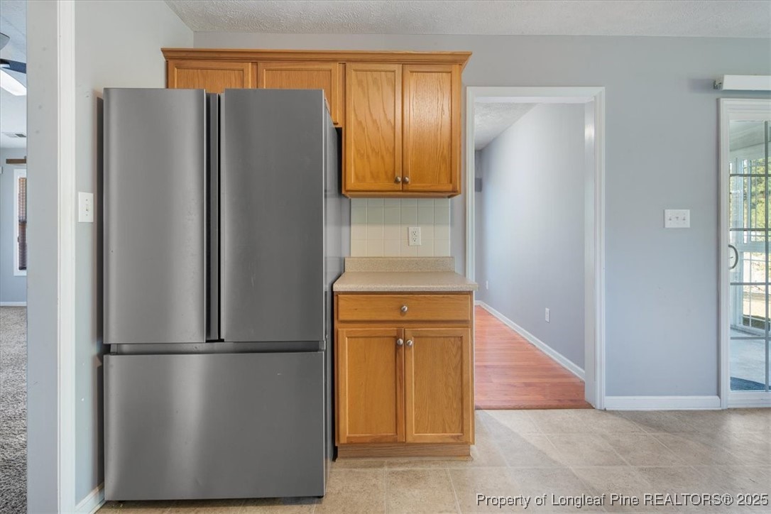 103 Beaumont Court Raeford, NC 28376 - Photo 26 of 50 a view of kitchen with stainless steel appliances wooden floor and chair