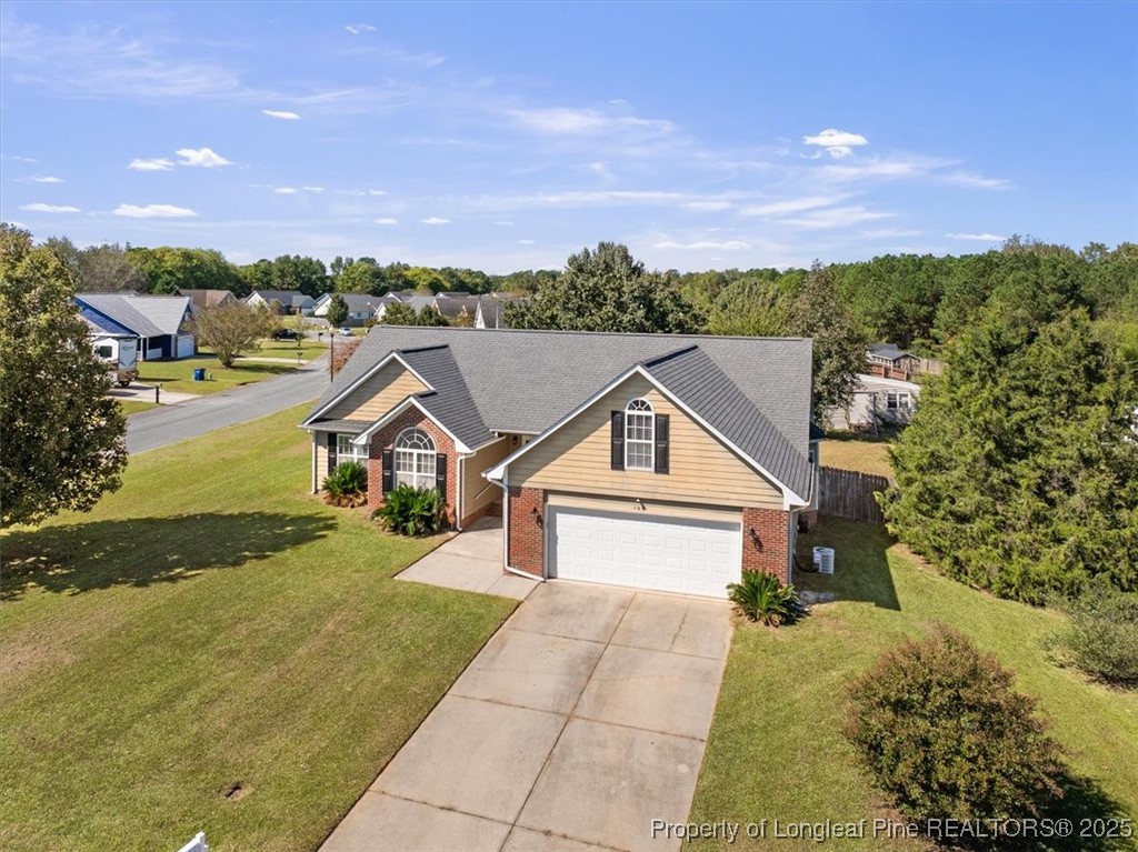 103 Beaumont Court Raeford, NC 28376 - Photo 3 of 50 a view of a house with a yard and potted plants