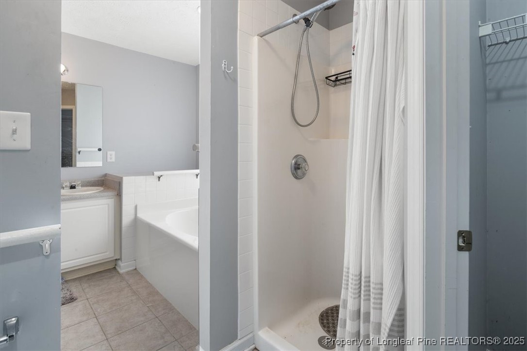103 Beaumont Court Raeford, NC 28376 - Photo 34 of 50 a bathroom with a shower a toilet and a shower