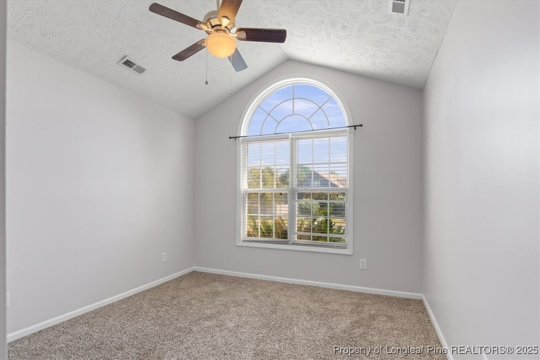 103 Beaumont Court Raeford, NC 28376 - Photo 36 of 50 an empty room with a window and a ceiling fan